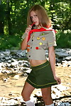 Dirty infant gal teases next to a stream in her Darling Guides uniform