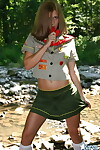 Dirty infant gal teases next to a stream in her Darling Guides uniform