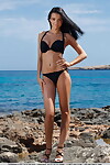 Euro dark hair Sapphira A sunning her exposed damp body on the beach