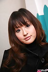 Japanese cutie with a fabulous face dears non undressed in a ebon coat and jeans
