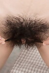 Ebon haired girl Luna O sheds her cotton underclothing to display her furry bush