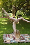 Attractive fairy Emma Starletto shows off her flexibility whilst nude in the yard