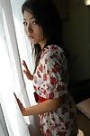 Eastern young Nao Miyazaki undressing and exposing her gentile in close up