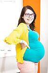 Glasses wearing infant concepted solo babe revealing baby bump and mambos
