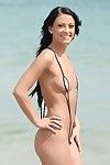 Undressing darling Kelly Diamond X is showing her body on a beach