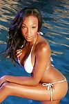 Outdoor posing at the pool features dark hair ebon pornstar Alanna
