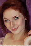 Redhead solo hottie Leona Chicita exposing stiff youthful arse and smooth head gentile