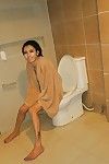 Thai t-girl Alice washes away anal creampie in washroom afterward BB anal digging