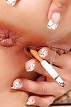 Perverse adolescent teasing her broke through cum-hole with a cigarette and fist-fucking it