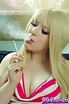 Elegant golden-haired floozy msinhale admires smokin\' cigarettes despite the fact u wat