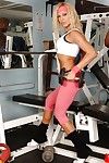 Fairy bodybuilder in pink spandex g-string and brown shorts working out