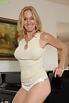 Golden-haired milf takes off her underwear at the same time as playing with her gigantic wobblers