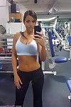 Rounded sporty fitness lass flashing at public gym