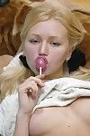 Without clothes anne licking a sweetie in pigtails bare