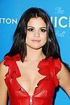 Selena gomez showing pokies and cleavage in red leather