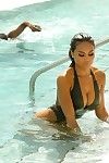 Daphne enjoyment shows sideboob and waste in swimsuit poolside