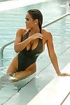 Daphne enjoyment shows sideboob and waste in swimsuit poolside