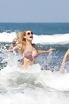 Michelle hunziker curvy in a diminutive pink bikini at the beach