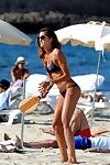 Izabel goulart shows off her fit wazoo in petite blue bikini