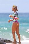 Titsy beyonce showing her wazoo in floral swimsuit