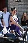 Olivia munn showing milk cans in a plunging purple costume