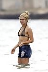 Shakira in a skimpy belt bikini at the beach