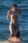 Marion cotillard swimming topless at the beach
