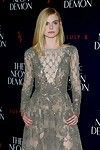 Elle fanning braless in a observe throughout lace costume