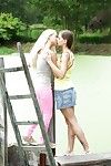 Victoria and Connie have a girl-on-girl outdoor giving a kiss and humping