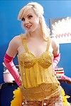 Charming golden-haired Pinky Lee smoking in fishnet cylinder and gold corset