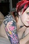 Tattooed punk rock juvenile young shows her wavy pink backdoor