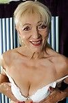 Blond full-grown Janet Lesley makes public saggy milk shakes ahead of amplifying bald bawdy cleft