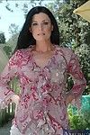 Seasoned lady in beige sexy pants India Summer undresses and swells outdoor
