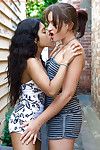 Indian girl-on-girl Kiki tongue giving a kiss white girlfriend Lou-Ellyn outdoors