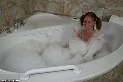 Adolescent babe Alyssa Hart loves to take soapy bubble bath while giving tug jobs