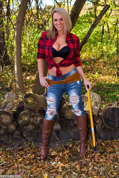 Immense boobed Nikki Sims is on of the hottest female lumberjacks around