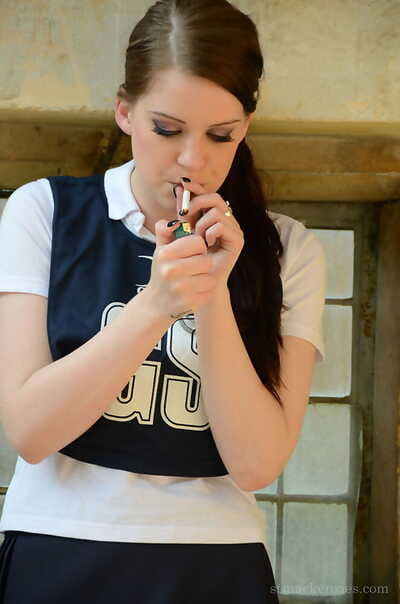 Smoking brunette Jessica-Ann Fegan doffs uniform to sun her hot ass outdoors
