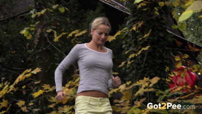Marvelous blonde Victoria Pure hikes her short skirt to take a pee along country lane