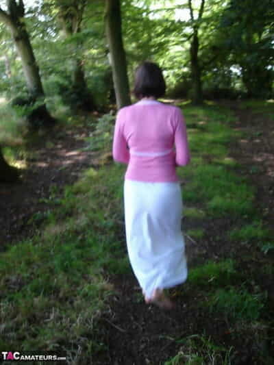 Older woman Slut Scot Susan gives a blowjob in the woods after baring her apple bottoms