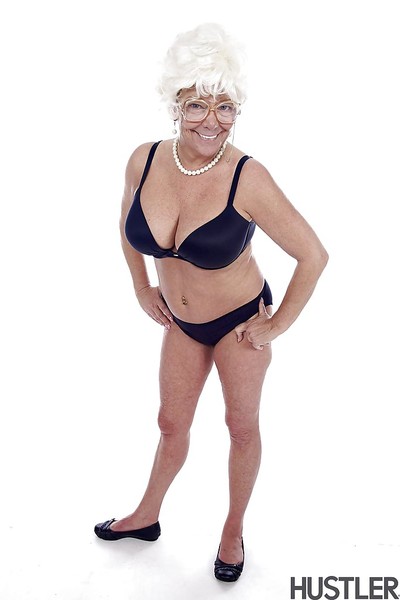 Granny pornstar Karen Summer modelling fully dressed before erotic dancing naked
