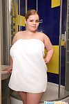 Naughty chubby gal posing naked in the showers