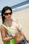 Sexy Charisma Cappelli in glasses in bikini shows her body outdoor