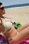 Sexy Charisma Cappelli in glasses in bikini shows her body outdoor