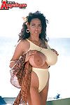 Beach babe Busty Angelique flaunting massive Latina pornstar whoppers outdoors