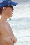Topless mommy on the beach