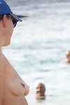 Topless mommy on the beach