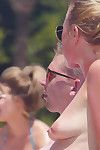 Clammy babe rubbing sun oil into her breast