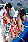 Alluring blond teenager having extreme sex with two guys on boat