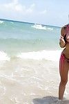 Teen babe Marsha May removes bikini on beach to bare phat arse and big boobs