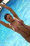 Ebony babe in pink bikini Bethany Benz posing outdoor by the pool